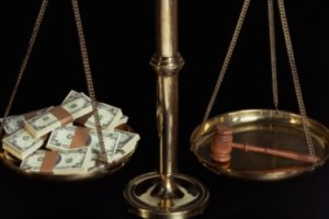 Scale with gavel and money